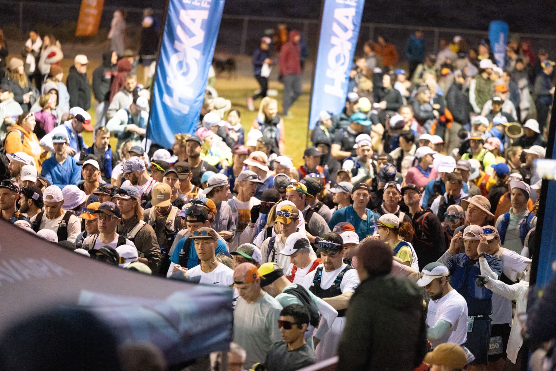 A packed field surges off the start line at the Black Canyon 100K